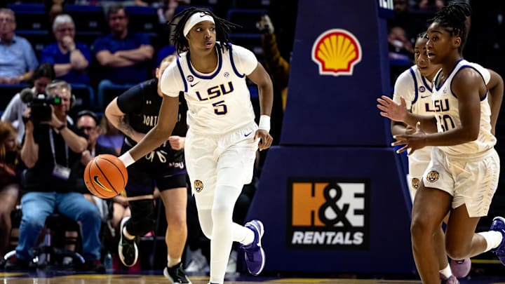 Nov 8, 2024; Baton Rouge, Louisiana, USA;  LSU Lady Tigers forward Sa'Myah Smith (5) brings the ball up court against the Northwestern State Lady Demons during the first half at Pete Maravich Assembly Center. Mandatory Credit: Stephen Lew-Imagn Images