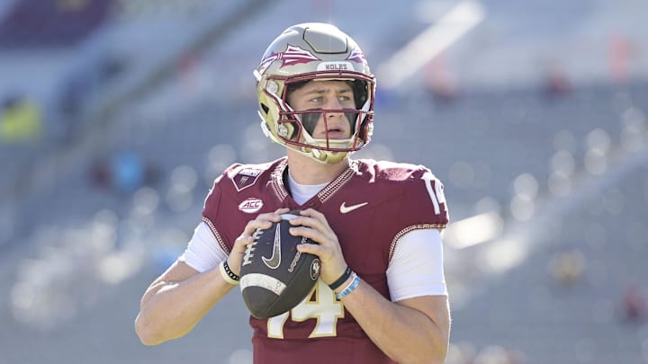 Nov 23, 2024; Tallahassee, Florida, USA; Florida State Seminoles quarterback Luke Kromenhoek (14) warms up before the game against the Charleston Southern Buccaneers at Doak S. Campbell Stadium. Mandatory Credit: Melina Myers-Imagn Images