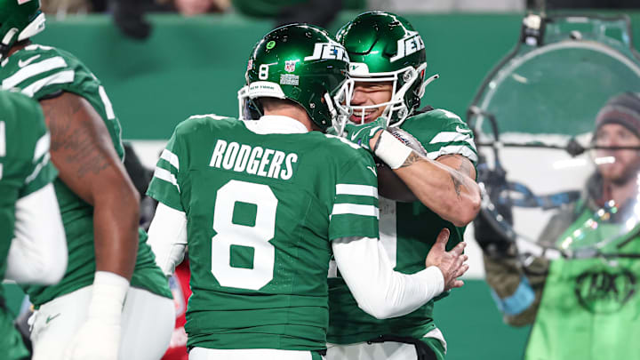 Jan 5, 2025; East Rutherford, New Jersey, USA; New York Jets wide receiver Allen Lazard (10) celebrates his touchdown reception with quarterback Aaron Rodgers (8)  during the first half against the Miami Dolphins at MetLife Stadium. Mandatory Credit: Vincent Carchietta-Imagn Images