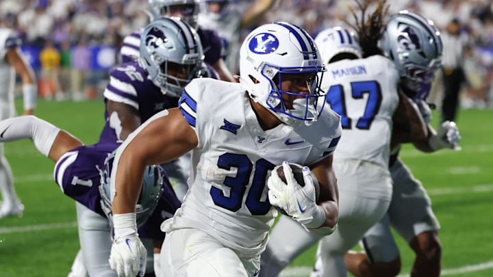 Sep 21, 2024; Provo, Utah, USA; Brigham Young Cougars running back Sione I Moa (30) runs for a touchdown against the Kansas State Wildcats during the fourth quarter at LaVell Edwards Stadium. Sep 21, 2024; Provo, Utah, USA; Brigham Young Cougars running back Sione I Moa (30) runs for a touchdown against the Kansas State Wildcats during the fourth quarter at LaVell Edwards Stadium.
