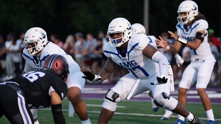 IMG's Jordan Seaton (77) protects his quarterback against a Lipscomb defender at Lipscomb's Reese