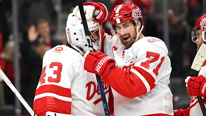 Mar 12, 2025; Detroit, Michigan, USA; Detroit Red Wings center Dylan Larkin (71) celebrates with goalie Petr Mrazek (43) after the Red Wings defeated the Buffalo Sabres at Little Caesars Arena. Mandatory Credit: Lon Horwedel-Imagn Images