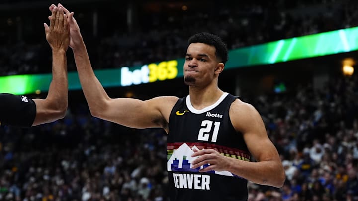 Dec 25, 2025; Denver, Colorado, USA; Denver Nuggets forward Spencer Jones (21) reacts against the Minnesota Timberwolves during the second half at Ball Arena. Mandatory Credit: Ron Chenoy-Imagn Images