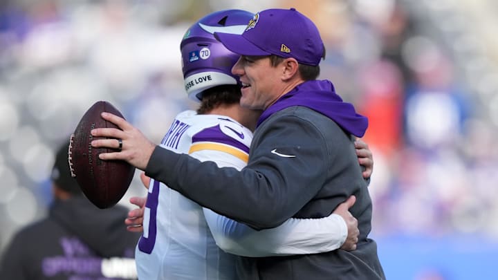 Dec 21, 2025; East Rutherford, New Jersey, USA; Minnesota Vikings quarterback J.J. McCarthy (9) and head coach Kevin O'Connell hug before the game at MetLife Stadium.