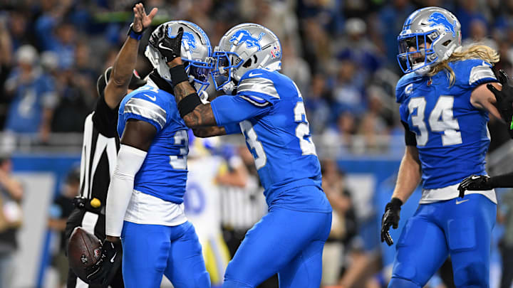 Sep 8, 2024; Detroit, Michigan, USA; Detroit Lions safety Kerby Joseph (31) celebrates with cornerback Carlton Davis III (23) after intercepting Los Angeles Rams quarterback Matthew Stafford (not pictured) in the end zone at the end of the first half at Ford Field.