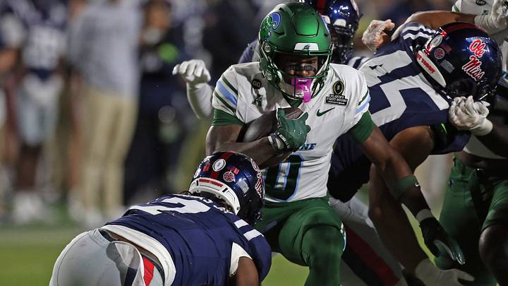 Dec 20, 2025; Oxford, MS, USA; Tulane Green Wave running back Maurice Turner (0) runs the ball during the fourth quarter against the Mississippi Rebels at Vaught-Hemingway Stadium. Mandatory Credit: Petre Thomas-Imagn Images Dec 20, 2025; Oxford, MS, USA; Tulane Green Wave running back Maurice Turner (0) runs the ball during the fourth quarter against the Mississippi Rebels at Vaught-Hemingway Stadium. Mandatory Credit: Petre Thomas-Imagn Images