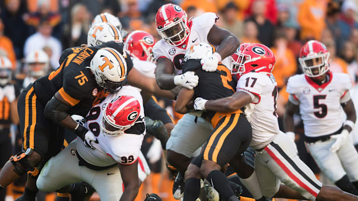 Tennessee running back Jabari Small (2) is tackled during an SEC football homecoming game between the Tennessee Volunteers and the Georgia Bulldogs in Neyland Stadium in Knoxville on Saturday, Nov. 13, 2021.