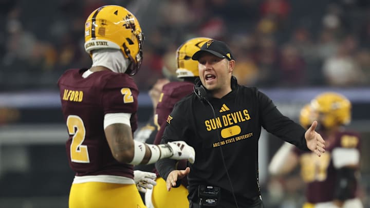 Dec 7, 2024; Arlington, TX, USA;  Arizona State Sun Devils head coach Kenny Dillingham speaks with Arizona State Sun Devils defensive back Xavion Alford (2) during the first half against the Iowa State Cyclones at AT&T Stadium. Mandatory Credit: Kevin Jairaj-Imagn Images