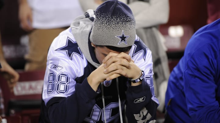 A fan of the Dallas Cowboys reacts after a loss to Washington at FedEx Field. 