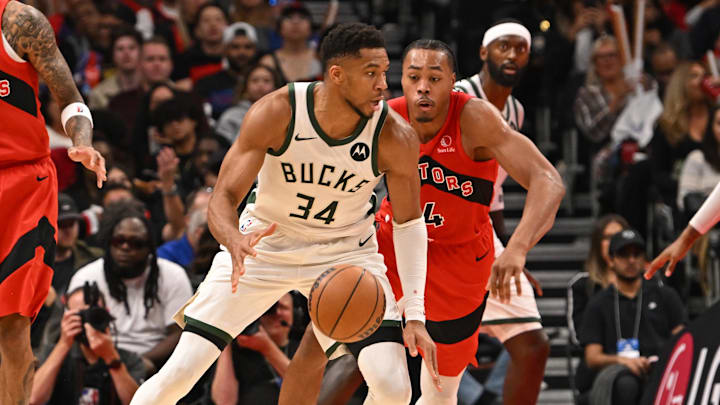 Oct 24, 2025; Toronto, Ontario, CAN; Milwaukee Bucks forward Giannis Antetokounmpo (34) is defended by Toronto Raptors forward Scottie Barnes (4) in the fourth quarter at Scotiabank Arena. Mandatory Credit: Gerry Angus-Imagn Images Oct 24, 2025; Toronto, Ontario, CAN; Milwaukee Bucks forward Giannis Antetokounmpo (34) is defended by Toronto Raptors forward Scottie Barnes (4) in the fourth quarter at Scotiabank Arena. Mandatory Credit: Gerry Angus-Imagn Images