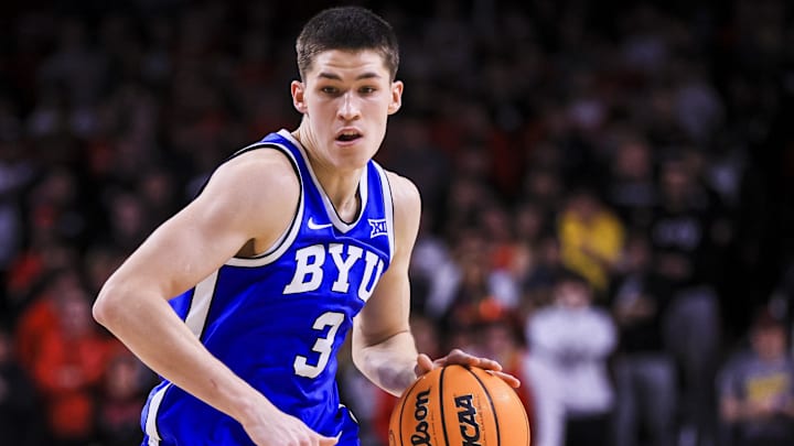 Feb 8, 2025; Cincinnati, Ohio, USA; Brigham Young Cougars guard Egor Demin (3) dribbles against the Cincinnati Bearcats in the second half at Fifth Third Arena. Mandatory Credit: Katie Stratman-Imagn Images