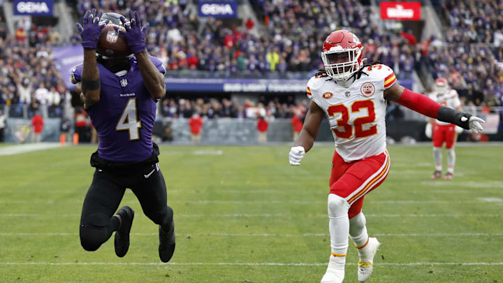 Jan 28, 2024; Baltimore, Maryland, USA; Baltimore Ravens wide receiver Zay Flowers (4) catches a touchdown pass as Kansas City Chiefs linebacker Nick Bolton (32) defends during the first quarter in the AFC Championship football game at M&T Bank Stadium. Jan 28, 2024; Baltimore, Maryland, USA; Baltimore Ravens wide receiver Zay Flowers (4) catches a touchdown pass as Kansas City Chiefs linebacker Nick Bolton (32) defends during the first quarter in the AFC Championship football game at M&T Bank Stadium.