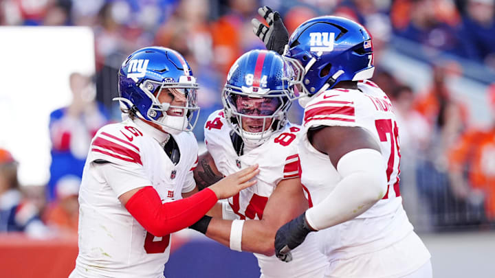 Oct 19, 2025; Denver, Colorado, USA; New York Giants quarterback Jaxson Dart (6), New York Giants tight end Theo Johnson (84) and New York Giants offensive tackle Andrew Thomas (78) react after a play during the second half against the Denver Broncos at Empower Field at Mile High. Oct 19, 2025; Denver, Colorado, USA; New York Giants quarterback Jaxson Dart (6), New York Giants tight end Theo Johnson (84) and New York Giants offensive tackle Andrew Thomas (78) react after a play during the second half against the Denver Broncos at Empower Field at Mile High.