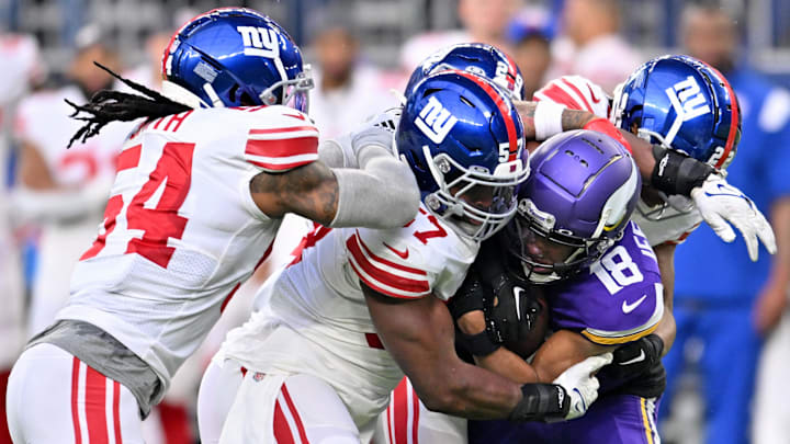 Jan 15, 2023; Minneapolis, Minnesota, USA; Minnesota Vikings wide receiver Justin Jefferson (18) is tackled by the New York Giants during the first quarter of a wild card game at U.S. Bank Stadium. Mandatory Credit: Jeffrey Becker-Imagn Images