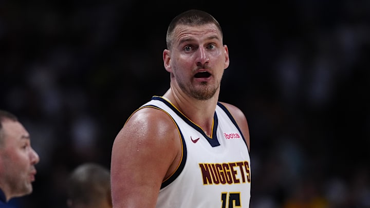 Apr 11, 2025; Denver, Colorado, USA; Denver Nuggets center Nikola Jokic (15) reacts in the fourth quarter against the Memphis Grizzlies at Ball Arena. Mandatory Credit: Ron Chenoy-Imagn Images
