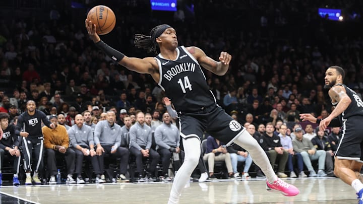 Oct 29, 2025; Brooklyn, New York, USA; Brooklyn Nets guard Terance Mann (14) saves the ball from going out of bounds in the fourth quarter against the Atlanta Hawks at Barclays Center. Mandatory Credit: Wendell Cruz-Imagn Images