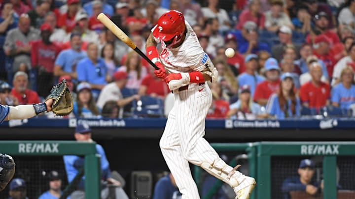 Sep 10, 2024; Philadelphia, Pennsylvania, USA; Philadelphia Phillies outfielder Nick Castellanos (8) gets hit by a pitch during the eighth inning against the Tampa Bay Rays at Citizens Bank Park. 