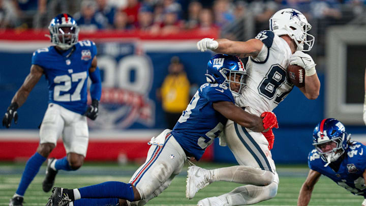 Sep 26, 2024; East Rutherford, NJ, US; Dallas Cowboys tight end Jake Ferguson (87) is taken down after catching a pass by New York Giants linebacker Bobby Okereke (58) at MetLife Stadium. Mandatory Credit: Julian Guadalupe-NorthJersey.com