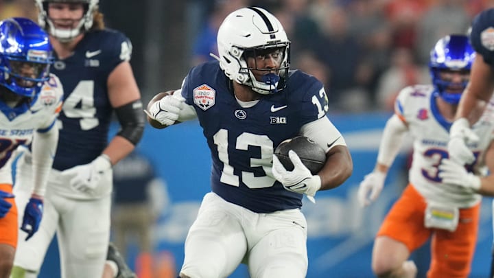 Penn State Nittany Lions running back Kaytron Allen (13) runs the ball against the Boise State Broncos during their Fiesta Bowl matchup at State Farm Stadium. 