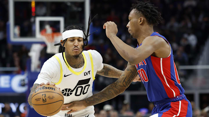 Dec 19, 2024; Detroit, Michigan, USA;  Utah Jazz guard Jordan Clarkson (00) dribbles defended by Detroit Pistons forward Ronald Holland II (00) in the third quarter at Little Caesars Arena. Mandatory Credit: Rick Osentoski-Imagn Images