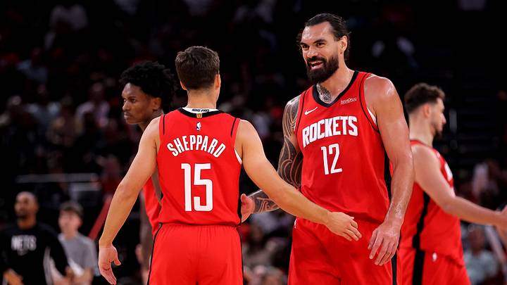 Oct 27, 2025; Houston, Texas, USA; Houston Rockets center Steven Adams (12) talks with Houston Rockets guard Reed Sheppard (15) after the first quarter against the Brooklyn Nets at Toyota Center. Mandatory Credit: Erik Williams-Imagn Images
