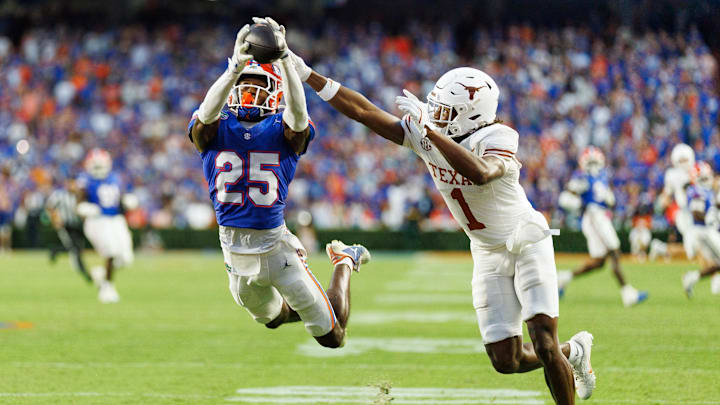 Oct 4, 2025; Gainesville, Florida, USA; Florida Gators defensive back Cormani McClain (25) attempts to intercept a pass intended for Texas Longhorns wide receiver Ryan Wingo (1) during the second half at Ben Hill Griffin Stadium. Mandatory Credit: Matt Pendleton-Imagn Images Oct 4, 2025; Gainesville, Florida, USA; Florida Gators defensive back Cormani McClain (25) attempts to intercept a pass intended for Texas Longhorns wide receiver Ryan Wingo (1) during the second half at Ben Hill Griffin Stadium. Mandatory Credit: Matt Pendleton-Imagn Images