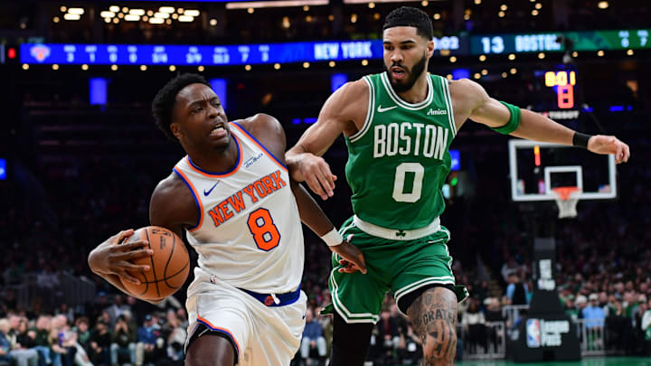 Feb 23, 2025; Boston, Massachusetts, USA;  New York Knicks forward OG Anunoby (8) drives to the basket while Boston Celtics forward Jayson Tatum (0) defends during the first half at TD Garden. Mandatory Credit: Bob DeChiara-Imagn Images