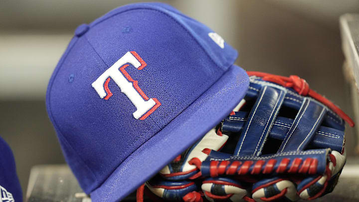 Jul 26, 2024; Toronto, Ontario, CAN; A hat and glove of a Texas Rangers player during a game against the Toronto Blue Jays at Rogers Centre. 
