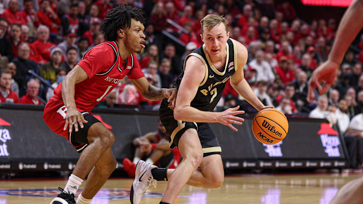 Purdue guard Fletcher Loyer (2) is guarded by Rutgers guard Jamichael Davis (1) 