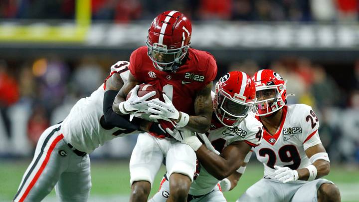 Alabama Crimson Tide receiver Jameson Williams is brought down by a slew of Georgia Bulldogs defenders Monday, Jan. 10, 2022, during the College Football Playoff national championship game at Lucas Oil Stadium in Indianapolis.

Syndication The Indianapolis Star