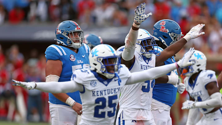 Sep 28, 2024; Oxford, Mississippi, USA; Kentucky Wildcats defensive back Jordan Lovett (25) and linebacker Jayvant Brown (34) react after the Mississippi Rebels missed a game tying field goal during the second half at Vaught-Hemingway Stadium. Mandatory Credit: Petre Thomas-Imagn Images