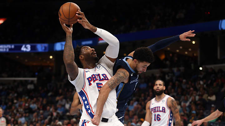 Nov 20, 2024; Memphis, Tennessee, USA; Philadelphia 76ers center Andre Drummond (5) shoots as Memphis Grizzlies guard Scotty Pippen Jr. (1) defends during the first half at FedExForum. Mandatory Credit: Petre Thomas-Imagn Images