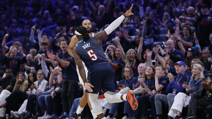 Apr 22, 2026; Oklahoma City, Oklahoma, USA; Oklahoma City Thunder guard Luguentz Dort (5) gestures after scoring against the Phoenix Suns in the second half during game two of the first round of the 2026 NBA Playoffs at Paycom Center.