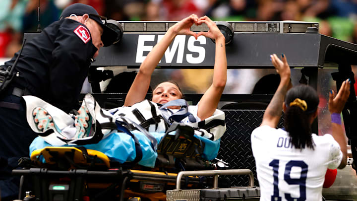 Mallory Swanson suffers torn patella in match vs. Ireland. 