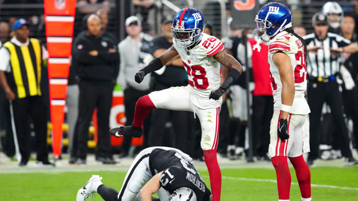 Nov 5, 2023; Paradise, Nevada, USA; New York Giants cornerback Cor'Dale Flott (28) celebrates after breaking up a reception attempt by Las Vegas Raiders wide receiver Hunter Renfrow (13) during the fourth quarter at Allegiant Stadium. 