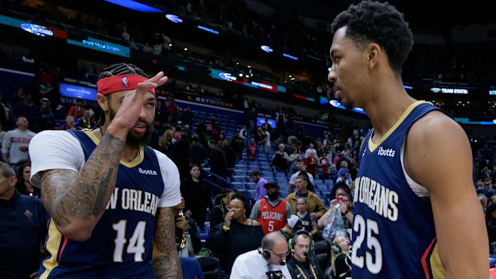 Dec 28, 2023; New Orleans, Louisiana, USA;  New Orleans Pelicans forward Brandon Ingram (14) salutes New Orleans Pelicans guard Trey Murphy III (25) after defeating the Utah Jazz at the Smoothie King Center.