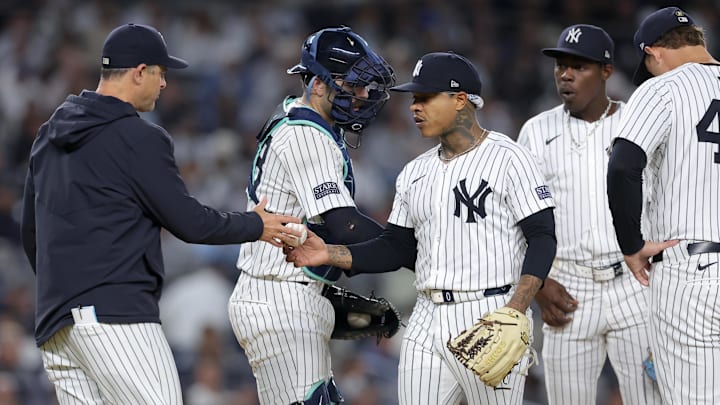 Sep 25, 2024; Bronx, New York, USA; New York Yankees manager Aaron Boone (17) takes the ball from starting pitcher Marcus Stroman (0) during the fourth inning against the Baltimore Orioles at Yankee Stadium. Sep 25, 2024; Bronx, New York, USA; New York Yankees manager Aaron Boone (17) takes the ball from starting pitcher Marcus Stroman (0) during the fourth inning against the Baltimore Orioles at Yankee Stadium.