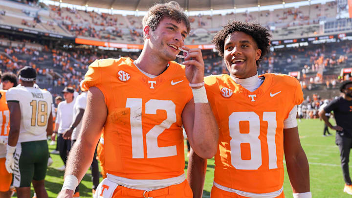 Tennessee quarterback Jake Merklinger (12) and Tennessee wide receiver Amari Jefferson (81) smile after a NCAA football game between Tennessee and UAB at Neyland Stadium in Knoxville, Tenn., September 20, 2025. Tennessee quarterback Jake Merklinger (12) and Tennessee wide receiver Amari Jefferson (81) smile after a NCAA football game between Tennessee and UAB at Neyland Stadium in Knoxville, Tenn., September 20, 2025.