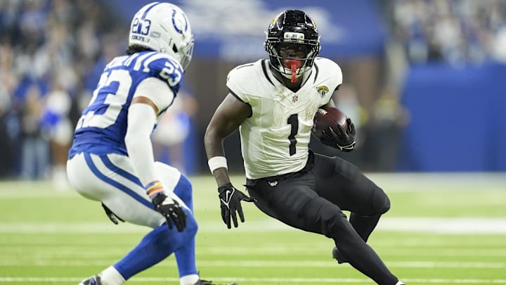 Dec 28, 2025; Indianapolis, Indiana, USA; Indianapolis Colts cornerback Kenny Moore II (23) looks to bring down Jacksonville Jaguars running back Travis Etienne Jr. (1) during a game at Lucas Oil Stadium. Mandatory Credit: Mykal McEldowney-USA TODAY Network via Imagn Images Dec 28, 2025; Indianapolis, Indiana, USA; Indianapolis Colts cornerback Kenny Moore II (23) looks to bring down Jacksonville Jaguars running back Travis Etienne Jr. (1) during a game at Lucas Oil Stadium. Mandatory Credit: Mykal McEldowney-USA TODAY Network via Imagn Images