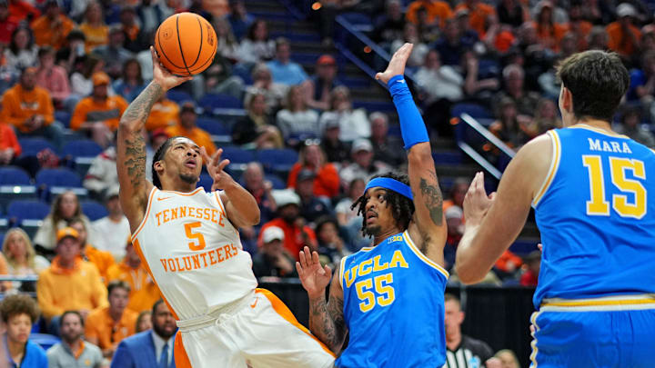 Mar 22, 2025; Lexington, KY, USA; Tennessee Volunteers guard Zakai Zeigler (5) shoots the ball against UCLA Bruins guard Skyy Clark (55) during the first half in the second round of the NCAA Tournament at Rupp Arena. Mandatory Credit: Aaron Doster-Imagn Images