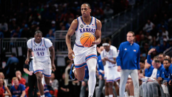 Mar 12, 2026; Kansas City, MO, USA; Kansas Jayhawks guard Elmarko Jackson (13) brings the ball up court during the first half against the TCU Horned Frogs at T-Mobile Center. Mandatory Credit: William Purnell-Imagn Images