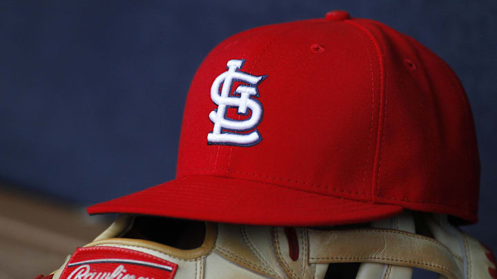 Oct 4, 2015; Atlanta, GA, USA; Detailed view of St. Louis Cardinals hat and glove in the dugout against the Atlanta Braves in the ninth inning at Turner Field. The Braves defeated the Cardinals 2-0. Mandatory Credit: Brett Davis-Imagn Images