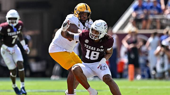 Sep 12, 2026; College Station, Texas, USA; Texas A&M Aggies defensive end T.J. Searcy (18) defends in coverage as Arizona State Sun Devils offensive lineman Jalen Klemm (70) attempt to block at Kyle Field. Mandatory Credit: Maria Lysaker-Imagn Images Sep 12, 2026; College Station, Texas, USA; Texas A&M Aggies defensive end T.J. Searcy (18) defends in coverage as Arizona State Sun Devils offensive lineman Jalen Klemm (70) attempt to block at Kyle Field. Mandatory Credit: Maria Lysaker-Imagn Images
