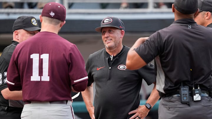 Georgia coach Wes Johnson speaks with Texas A&M coach Michael Earley before the start of a NCAA baseball game against Texas A&M in Athens, Ga., on Friday, May 16, 2025.