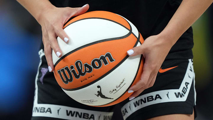 Aug 31, 2025; San Francisco, California, USA; Golden State Valkyries guard Kaitlyn Chen (2) holds a ball as the WNBA logo appears on the ball and shorts before the game against the Indiana Fever at Chase Center. Mandatory Credit: Darren Yamashita-Imagn Images