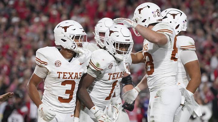 Texas Longhorns wide receiver Ryan Wingo (1) celebrates scoring a touchdown with teammates in the second half against the Georgia Bulldogs at Sanford Stadium. 