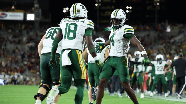 Oct 3, 2026; Tempe, Arizona, USA; Baylor Bears wide receiver Louis Brown IV (4) celebrates after Baylor Bears running back Caden Knighten (11) scores a touchdown against the Arizona State Sun Devils during the third quarter at Mountain America Stadium. Mandatory Credit: Anna Carrington Oct 3, 2026; Tempe, Arizona, USA; Baylor Bears wide receiver Louis Brown IV (4) celebrates after Baylor Bears running back Caden Knighten (11) scores a touchdown against the Arizona State Sun Devils during the third quarter at Mountain America Stadium. Mandatory Credit: Anna Carrington