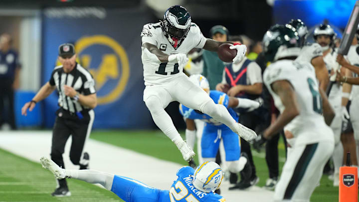 Dec 8, 2025; Inglewood, California, USA;  Philadelphia Eagles wide receiver A.J. Brown (11) runs against Los Angeles Chargers safety RJ Mickens (27) in the second half at SoFi Stadium. Mandatory Credit: Kirby Lee-Imagn Images