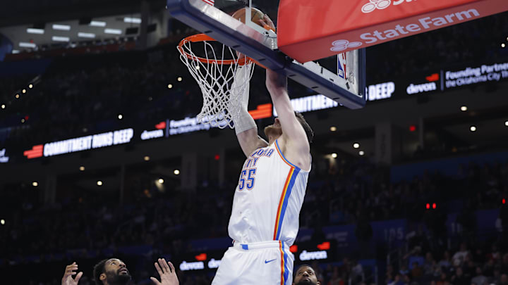 Dec 28, 2025; Oklahoma City, Oklahoma, USA; Oklahoma City Thunder center Isaiah Hartenstein (55) dunks against the Philadelphia 76ers during the second half at Paycom Center. Mandatory Credit: Alonzo Adams-Imagn Images