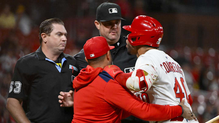 Aug 25, 2025; St. Louis, Missouri, USA;  St. Louis Cardinals designated hitter Willson Contreras (40) is held back by manager Oliver Marmol (37) after he was ejected by umpire Derek Thomas (53) during the seventh inning against the Pittsburgh Pirates at Busch Stadium. Mandatory Credit: Jeff Curry-Imagn Images